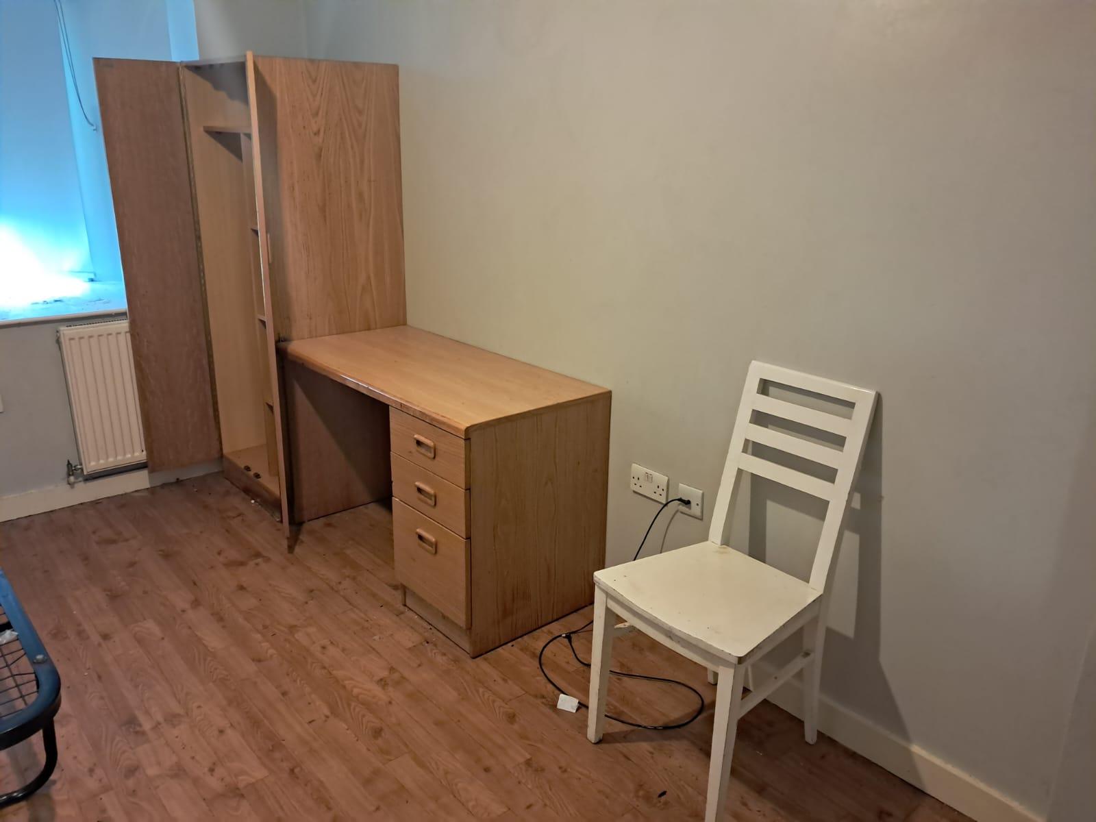 Wardrobe and desk area cleared and cleaned after a deep clean